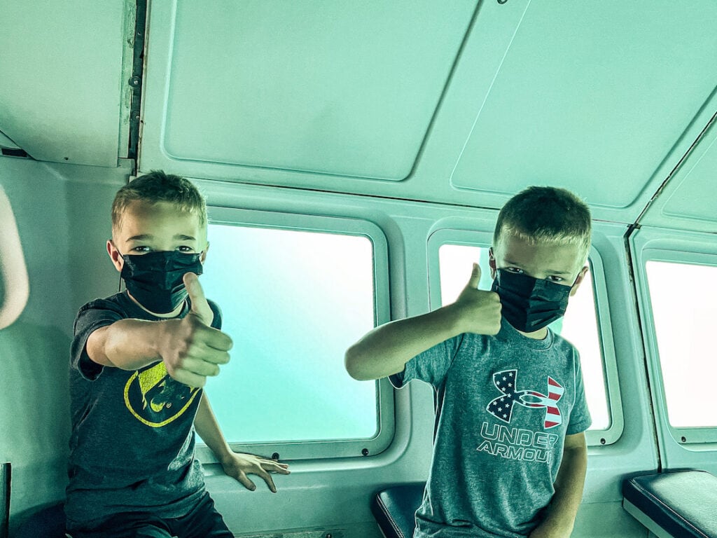 Two boys on the Atlantis Submarine tour in Maui. 
