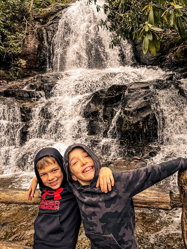 Two boys in front of Laurel Falls in Great Smoky Mountains National Park.