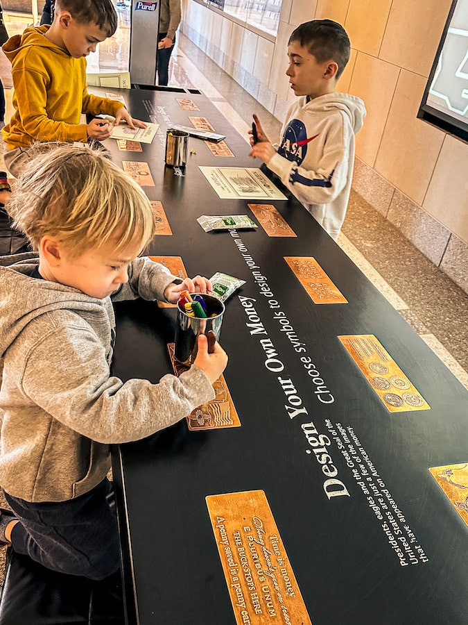 Kids designing their own money at the Money Museum in Kansas City, Missouri.