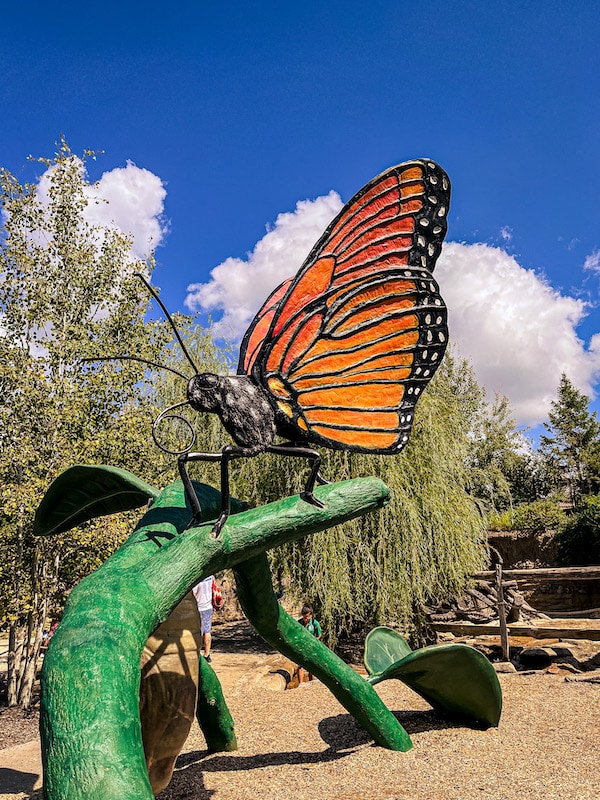 Monarch butterfly on a stem sculpture