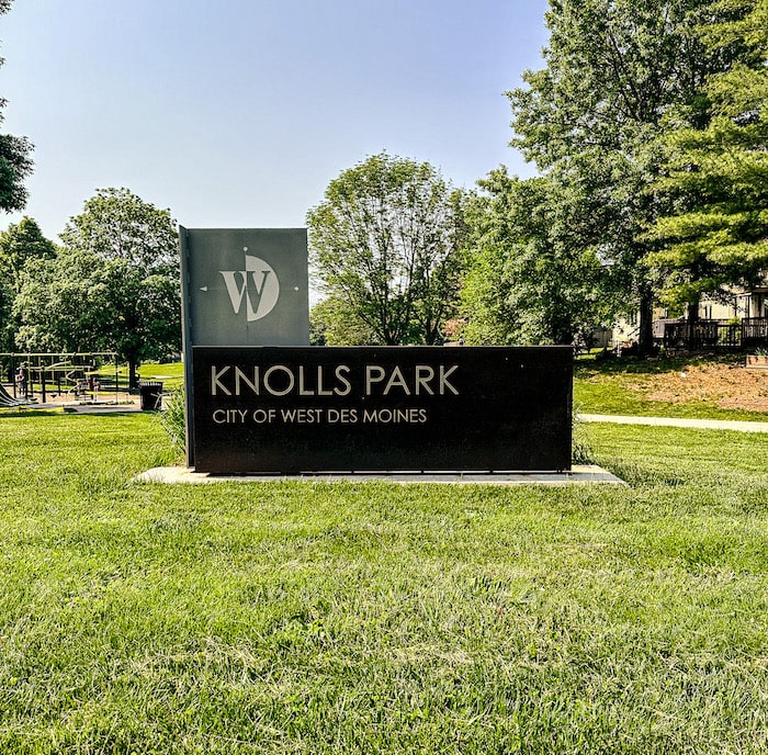 Brown and silver sign that reads Knolls Park