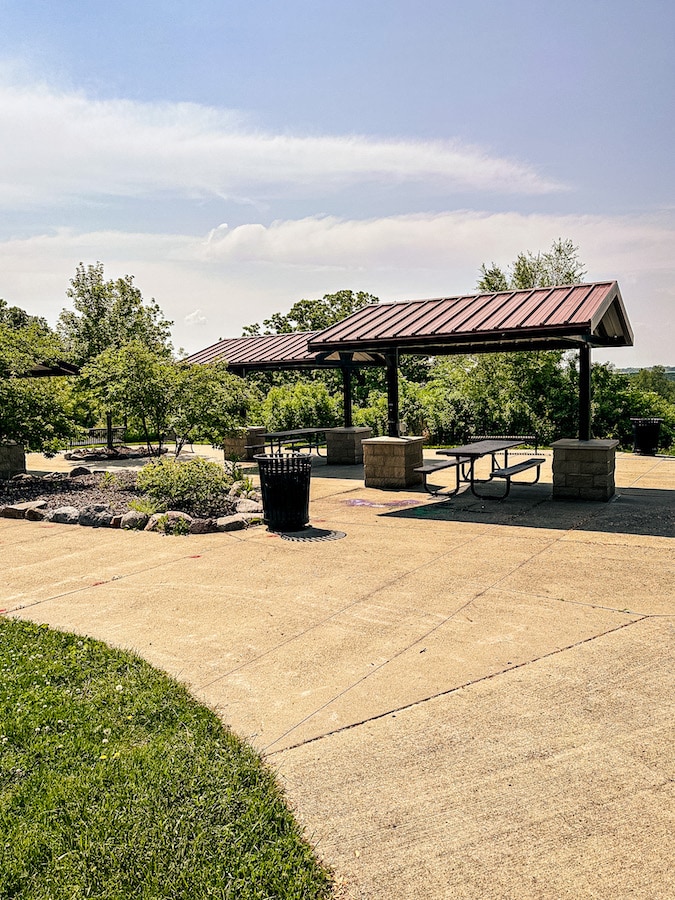 Covered picnic table area with trees in the background and scenic views