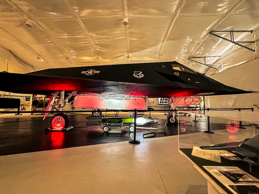 Black Stealth Fighter f-117 inside of a hanger