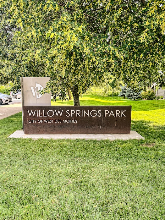 Brown sign for Willow Springs Park in the City of West Des Moines.