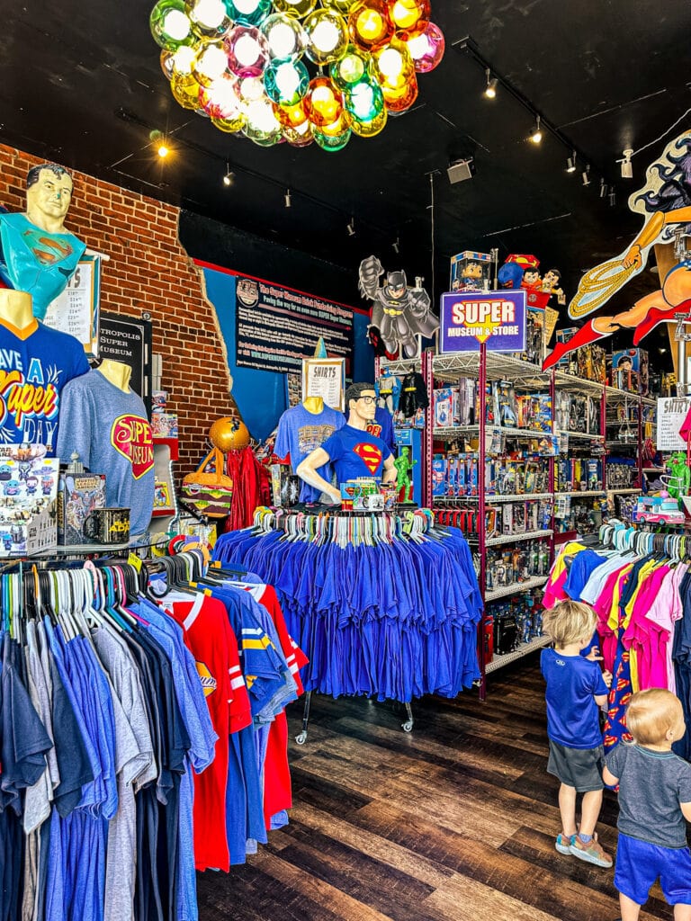 Inside of a gift shop with shirts and other Superman gifts