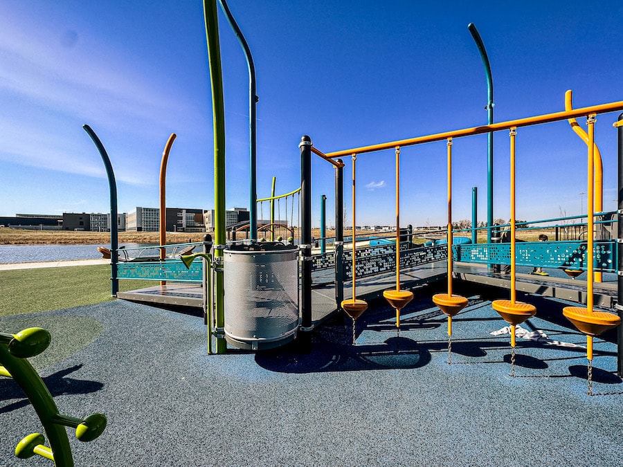 Playground with a rubber ground that has some orange obstacles