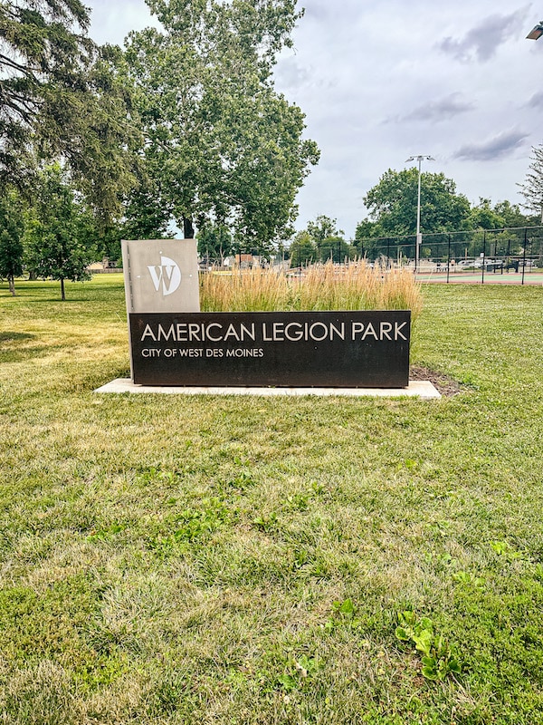 Brownish sign for American Legion Park in the city of West Des Moines