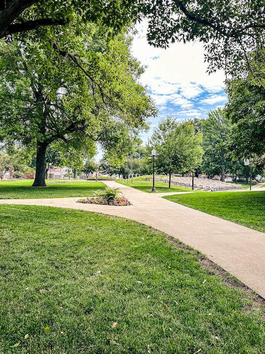 Walkway, grass, and trees in Central Park in Pella, Iowa.