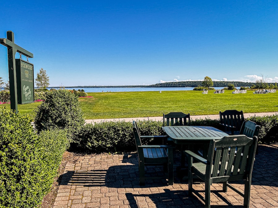 Mission Point Resort's Boxwood Coffee Shop patio overlooking the Great Lawn and the Straits of Mackinac.
