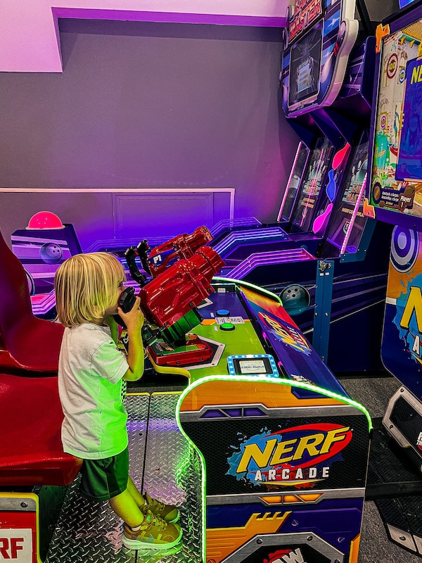 Boy playing a Nerf arcade game at Mission Point Resort.