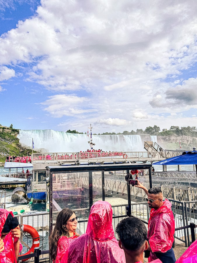 View of the Niagara City Cruises boat and dock with American Falls in the background.
