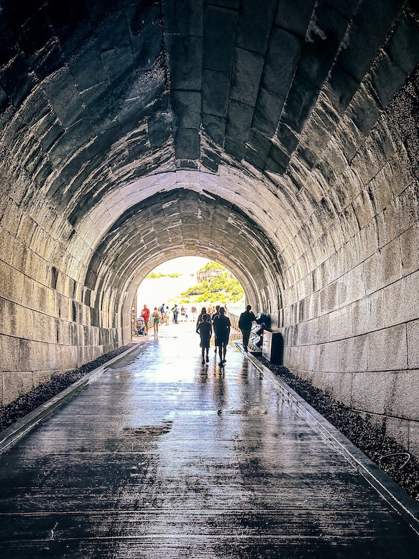 View inside of the tunnel at the Niagara Power Station and tunnel with the exit to the tunnel in the background.