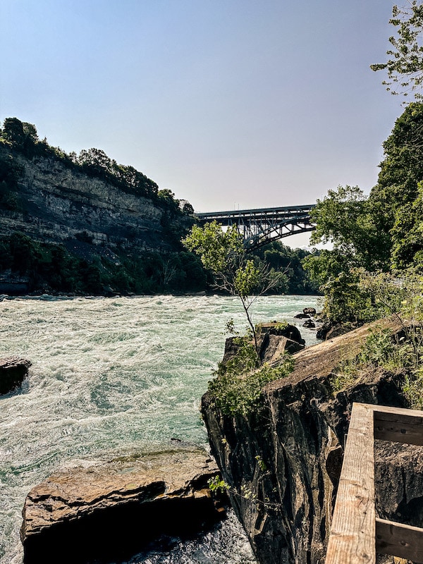 View of the Niagara River and bridge from the observation deck at the White Water Walk.