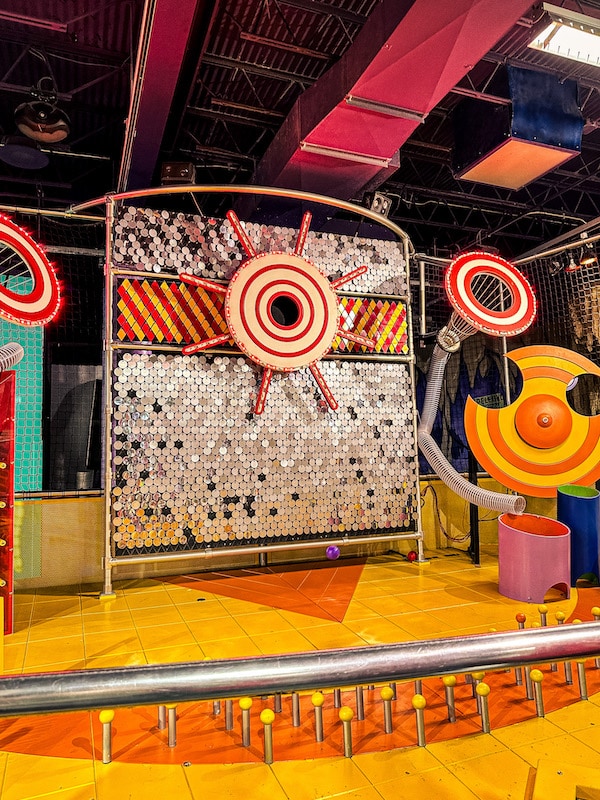 Targets for shooting plastic ball pit balls through a play shooter at the Omaha Children's Museum.