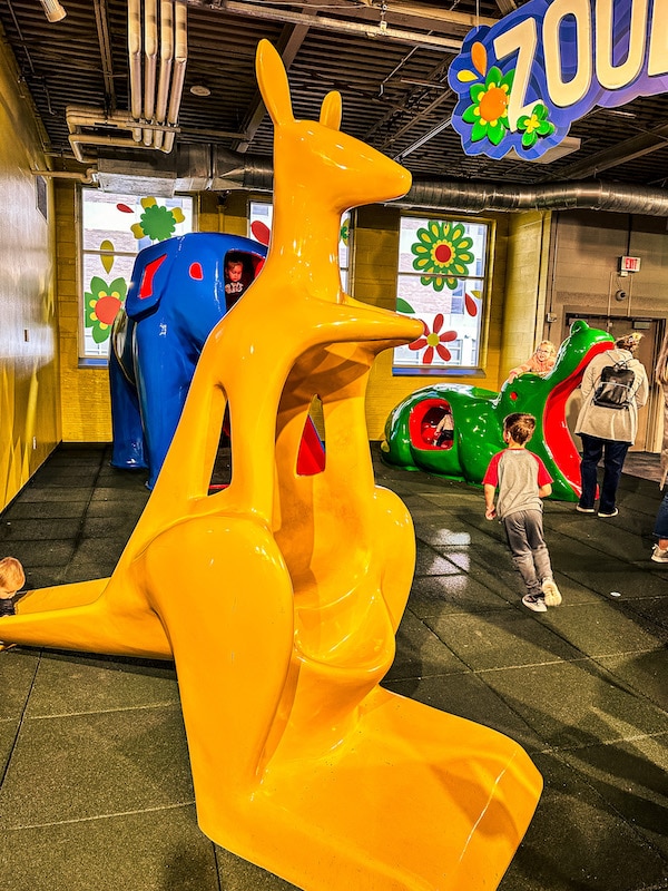 Yellow kangaroo slide in the Zooland exhibit at the Omaha Children's Museum.