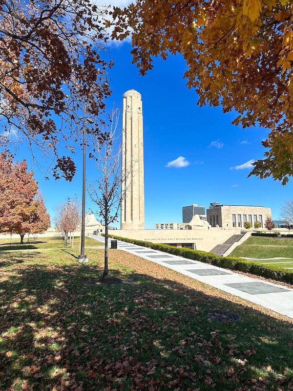 Liberty Memorial tower framed by orange fall leaves at the National WWI Museum and Memorial, Kansas City, MO.