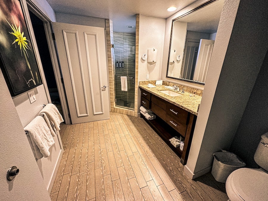 Master bathroom with double sinks and a walk in shower