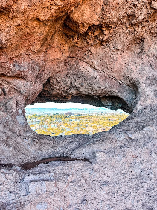 View through the rock opening at Hole in the Rock at Papago Park in Phoenix, Arizona.