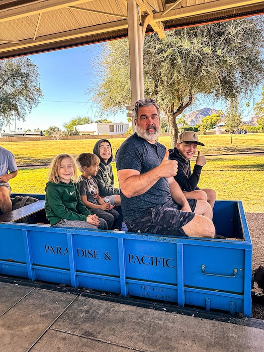Family riding the Paradise and Pacific Railroad.