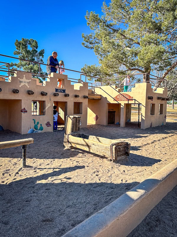 Kids playing at the Old Western Town Playground at McCormick-Stillman Railroad Park in Scottsdale, Arizona.