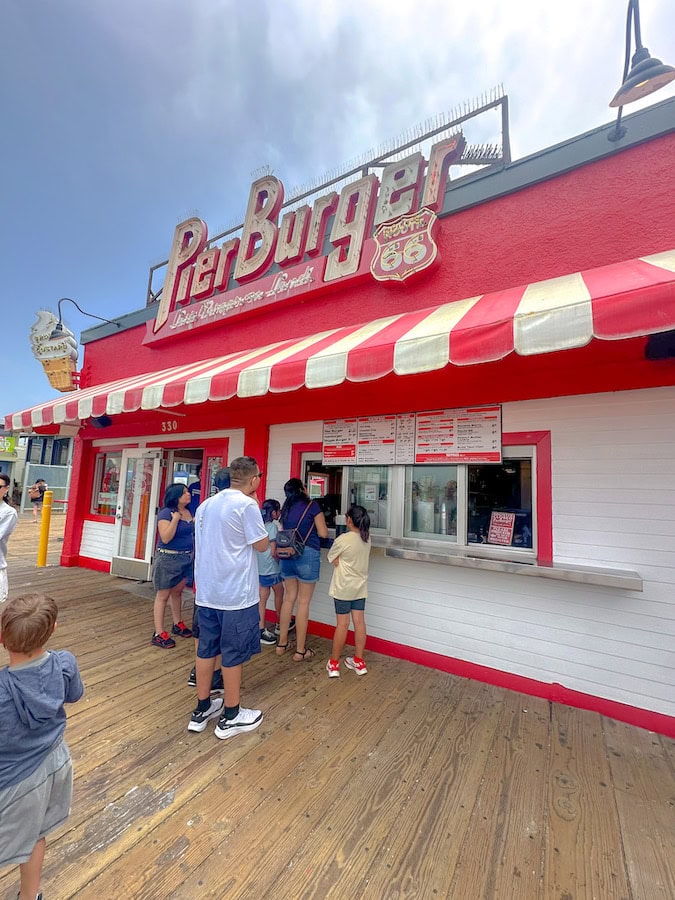 Visitors ordering food at Pier Burger on the Santa Monica Pier in California.