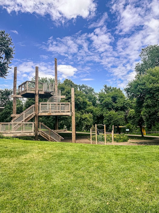 Multi-level wooden observation tower surrounded by open green space at Walker Johnston Park in Urbandale, Iowa.
