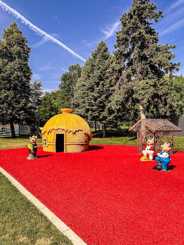 The Three Little Pigs display with their houses at Storybook Island in Rapid City, South Dakota.