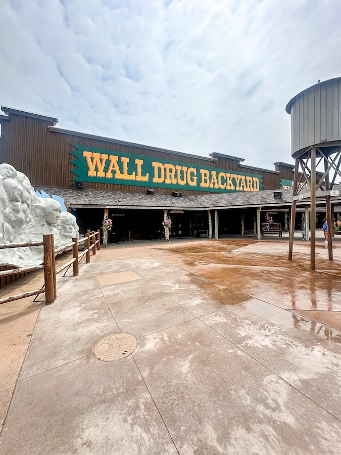 Wall Drug Backyard featuring the replica of Mount Rushmore, interactive water feature, and outdoor family attractions in Wall, South Dakota.