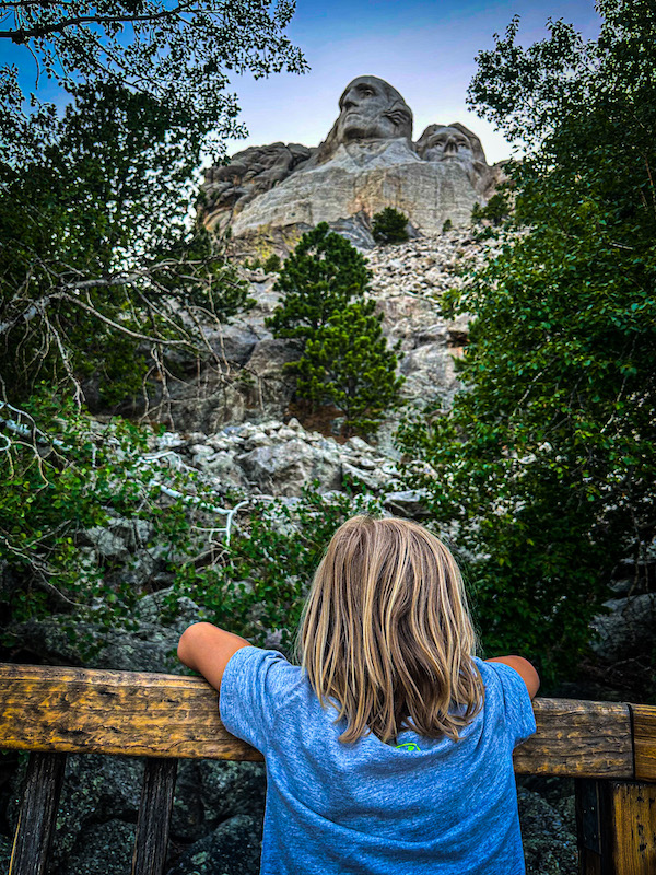 Child viewing Mount Rushmore from the Presidential Trail boardwalk at Mount Rushmore National Memorial.