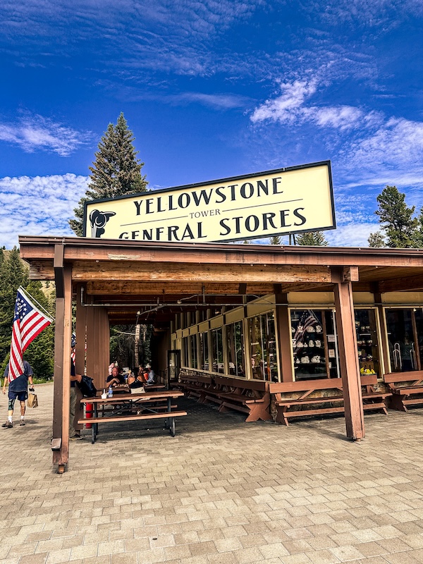 Yellowstone General Store near Tower Fall with picnic tables and outdoor seating in Yellowstone National Park.