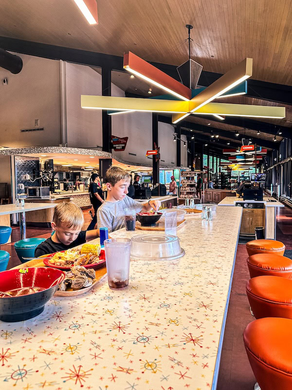 Children eating dinner at a counter inside Canyon Eatery in Yellowstone National Park